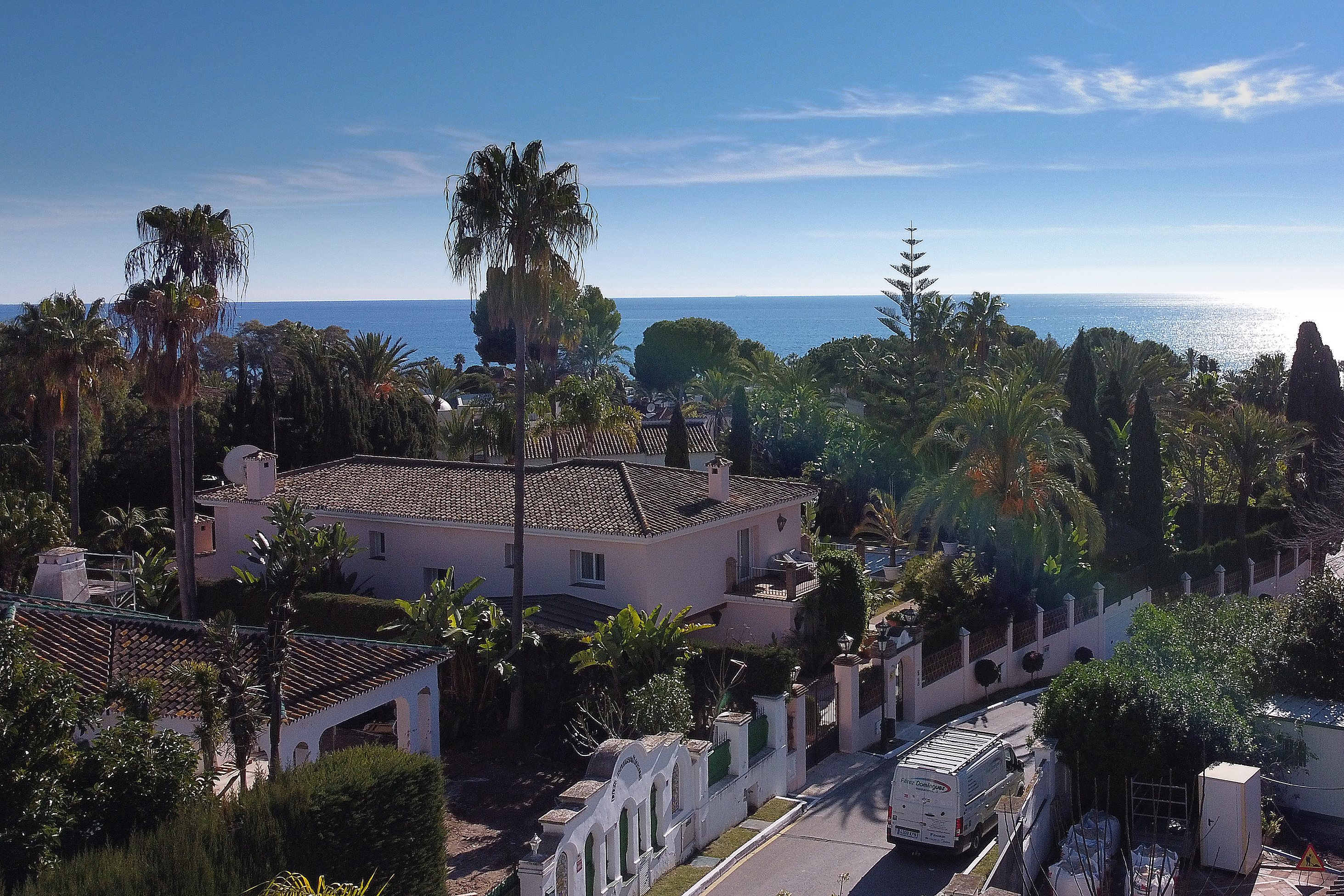 Drone view of the villa facade and swimming pool area